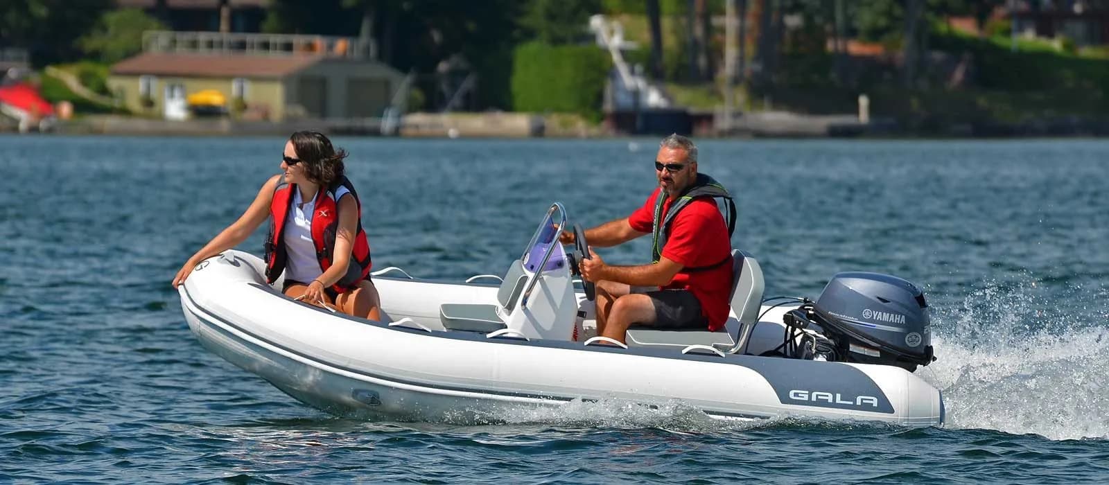 Gala Atlantis Deluxe tender carrying two passengers underway