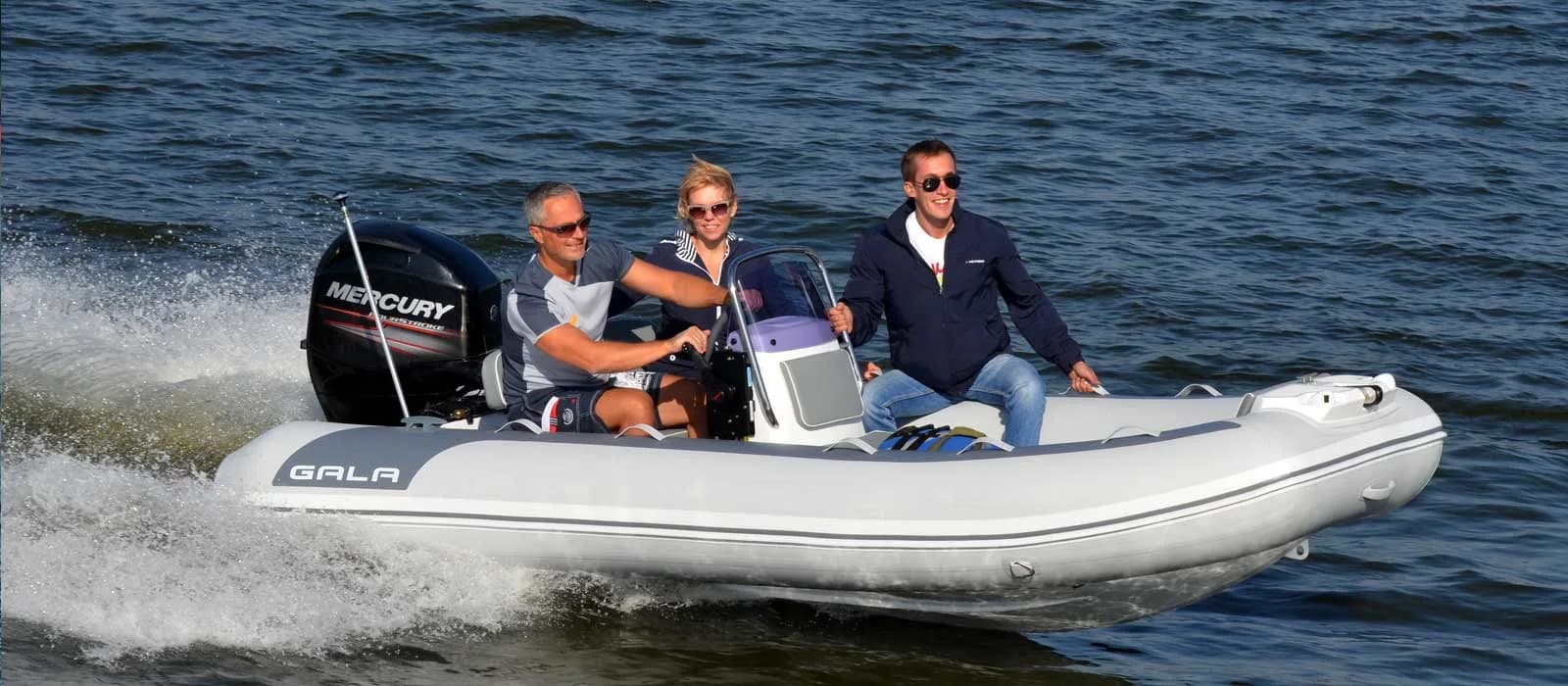 Gala Atlantis Deluxe tender carrying three passengers underway