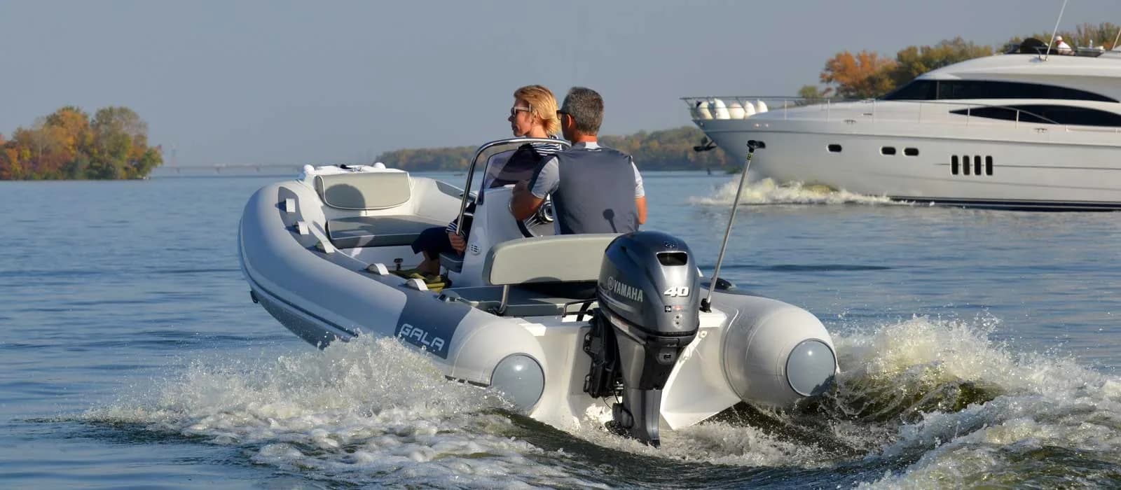 Gala Atlantis Deluxe tender running near a yacht