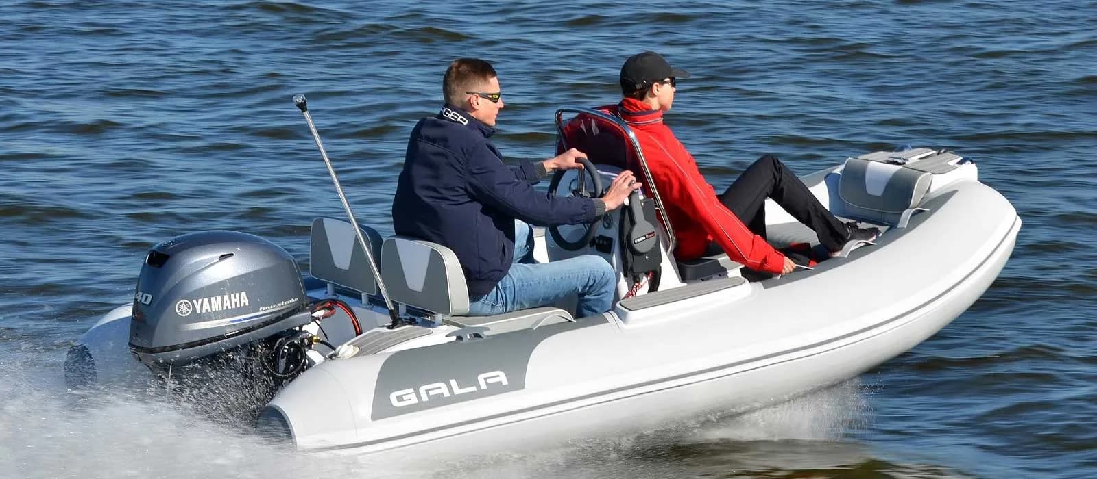 Gala Viking compact RIB carrying two passengers underway