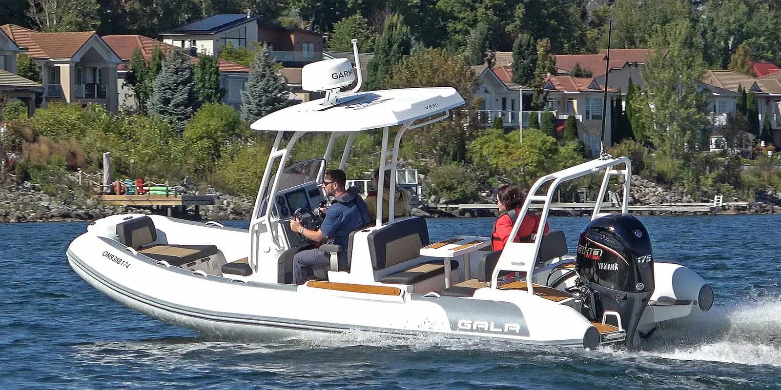 Gala Viking V650 underway near a shoreline