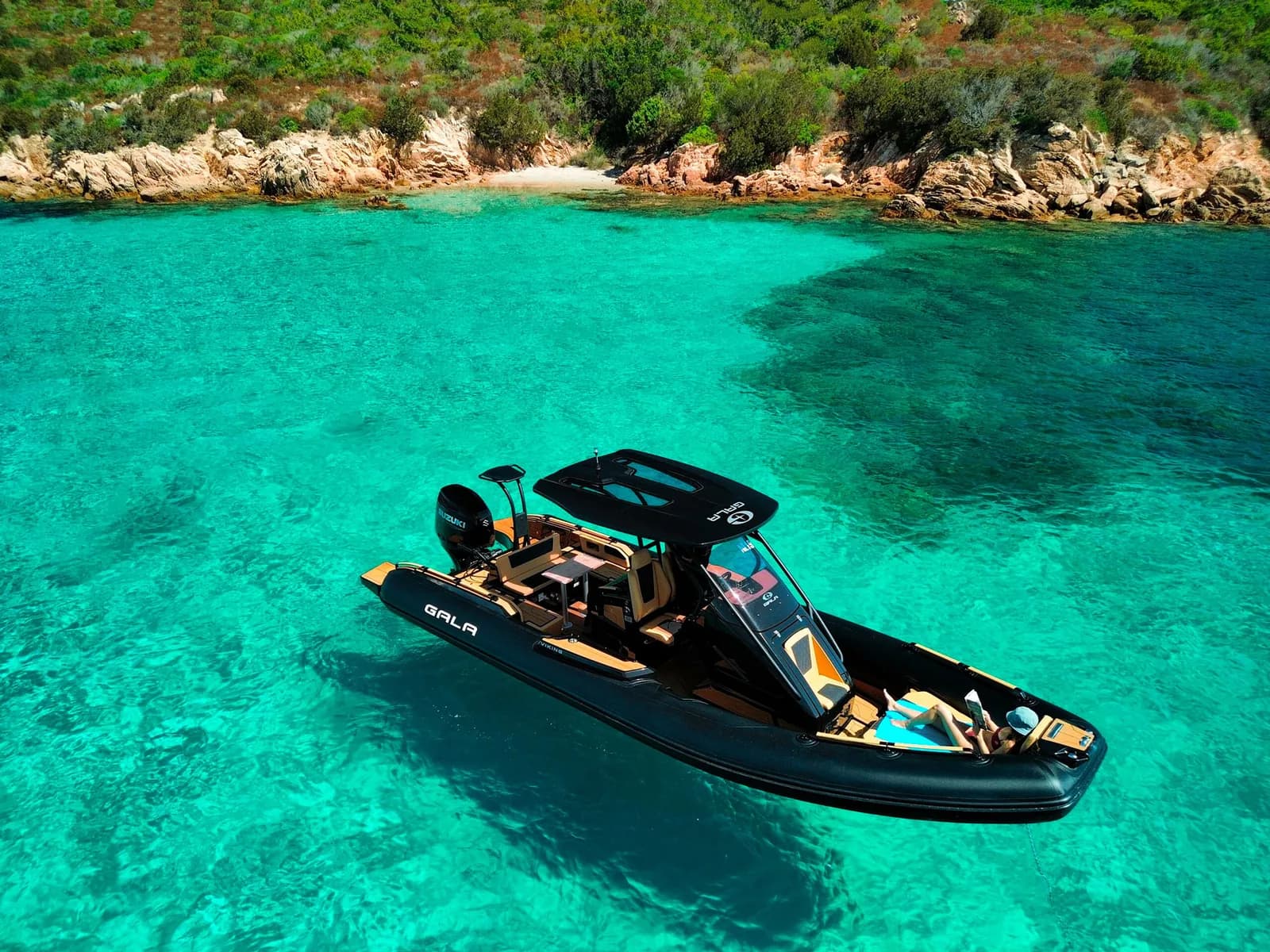 Black Gala Viking V8 moored in clear water